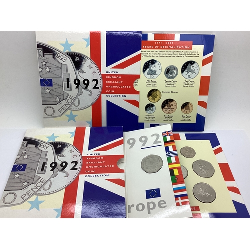 73A - Two Royal Mint UK 1992 Bunc Coin Sets, featuring dual dated 1992-1993 EEC 50p's.