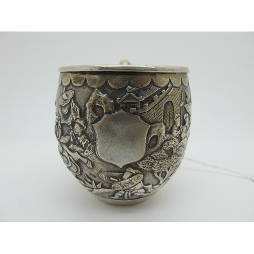 15 - A Chinese Cup, allover detailed in relief with battle scene, bamboo style handle, stamped character ... 