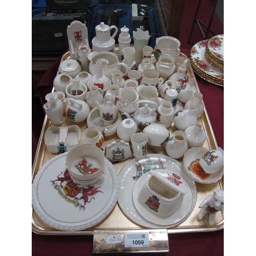 1059 - Crested China, including Goss 'Wales teapot stand, model of Welsh Jack, Teignmouth lighthouse, Jerse... 