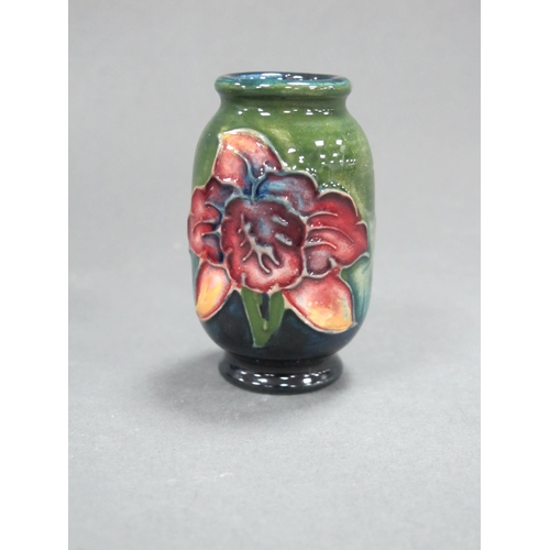 1060 - A Moorcroft Pottery Miniature Vase, of ovoid form, painted with the 'Bearded Iris' pattern on a gree... 