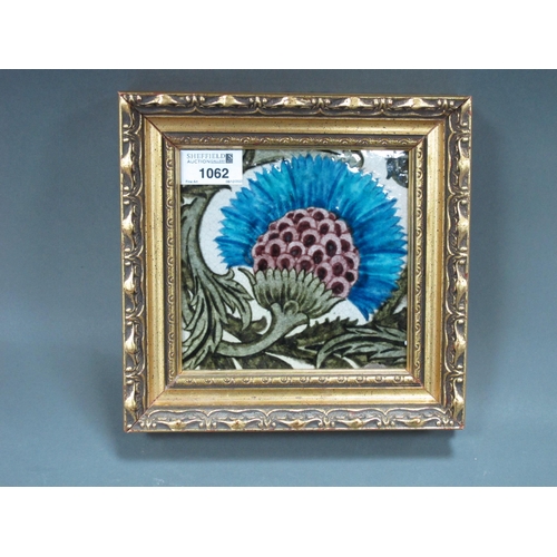 1062 - A William De Morgan Pottery Tile, painted with a BBB Carnation, impressed mark, framed, 14cm square.