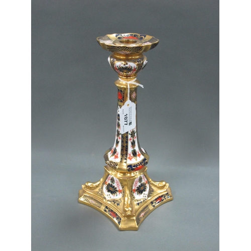 1077 - A Royal Crown Derby Candlestick, decorated in Imari pattern 1128, the tapered column raised on shape... 