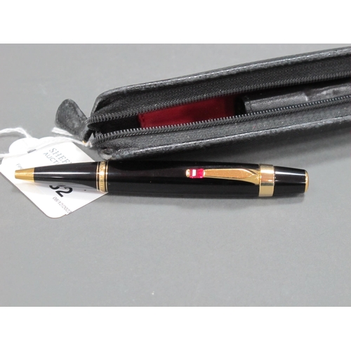 1182 - A Mont Blanc Ballpoint Pen, the black and gilt case set with ruby coloured stone, with a leather Mon... 