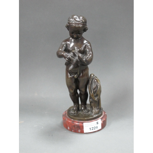 1224 - A XIX Century Bronze Figure of a Naked Girl Looking Down and Holding a Bird, on a circular red marbl... 