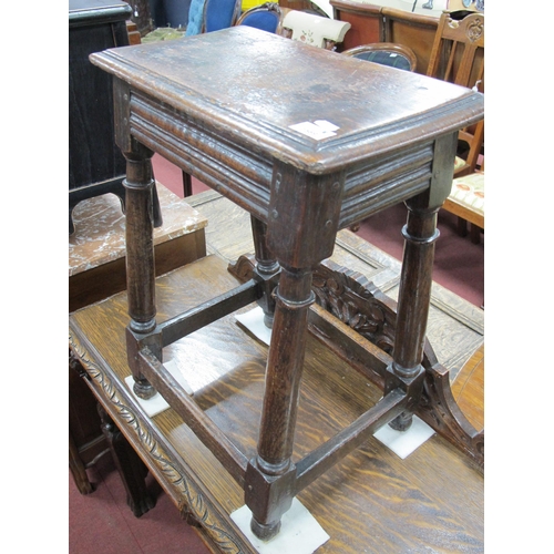 1569 - A XVII Century Oak Joint Stool, the top with moulded edge, on turned and block supports united by st... 