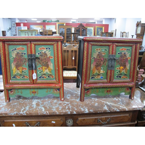 1571 - A Pair of Chinese Cabinets, with green painted panelled doors decorated with birds, brass lock plate... 