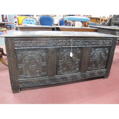 1574 - A XVII Century Joined Oak Coffer, with hinged top, the base with three lozenge carved panels and car... 