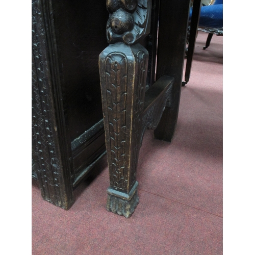 1573 - A XIX Century Carved Oak Side Table, with shaped back carved with a head, single drawer flanked by c... 