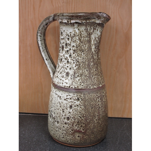 1052 - A Large Studio Pottery Ewer, of tapered form decorated in a speckled brown glaze, 37.5cm high and fo... 