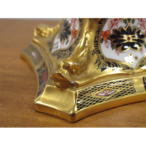 1077 - A Royal Crown Derby Candlestick, decorated in Imari pattern 1128, the tapered column raised on shape... 