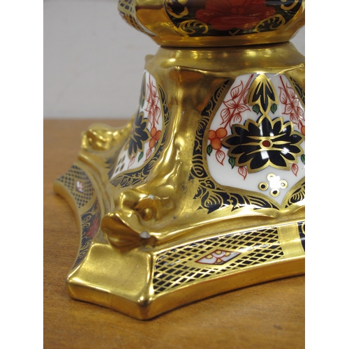 1077 - A Royal Crown Derby Candlestick, decorated in Imari pattern 1128, the tapered column raised on shape... 