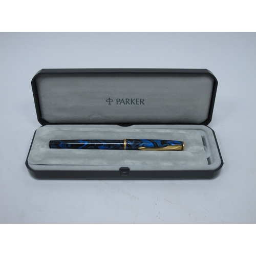 1199 - Three Parker 'Sonnet' Fountain Pens, in a mottled green, mottled red and yellow metal cases, boxed, ... 