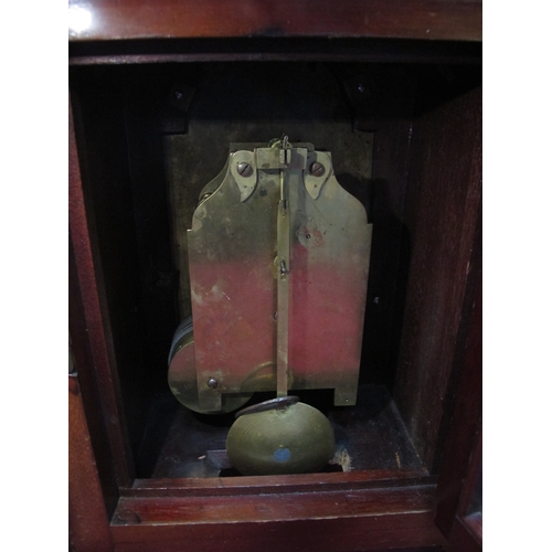 1475 - An Early XX Century Mahogany Cased Mantle Clock, the arched top above reeded column and stepped base... 