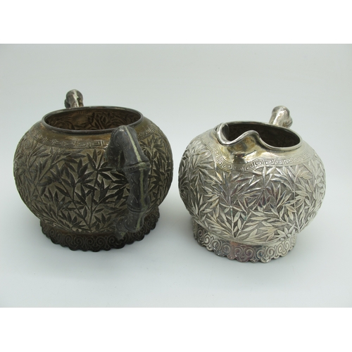 17 - A Chinese Three Piece Tea Set, each allover detailed in relief with bamboo (indistinctly stamped cha... 