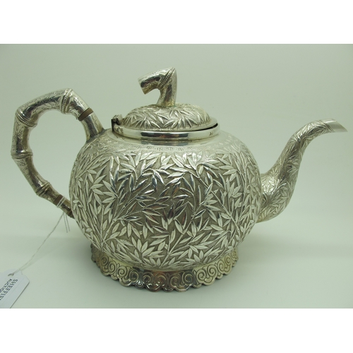 17 - A Chinese Three Piece Tea Set, each allover detailed in relief with bamboo (indistinctly stamped cha... 