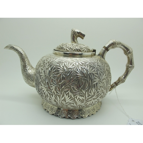 17 - A Chinese Three Piece Tea Set, each allover detailed in relief with bamboo (indistinctly stamped cha... 