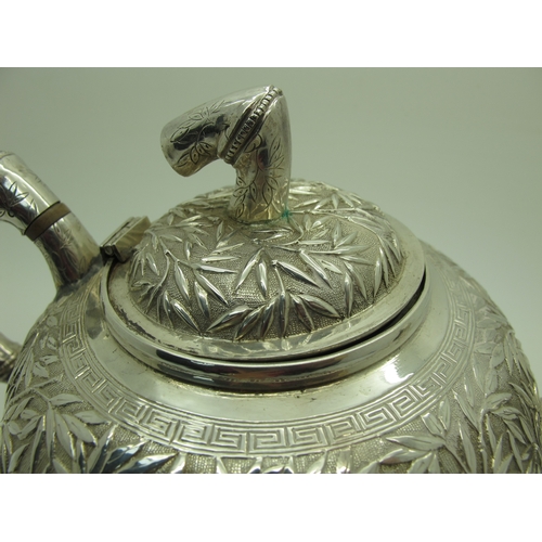 17 - A Chinese Three Piece Tea Set, each allover detailed in relief with bamboo (indistinctly stamped cha... 