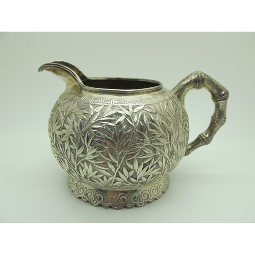 17 - A Chinese Three Piece Tea Set, each allover detailed in relief with bamboo (indistinctly stamped cha... 