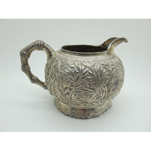 17 - A Chinese Three Piece Tea Set, each allover detailed in relief with bamboo (indistinctly stamped cha... 