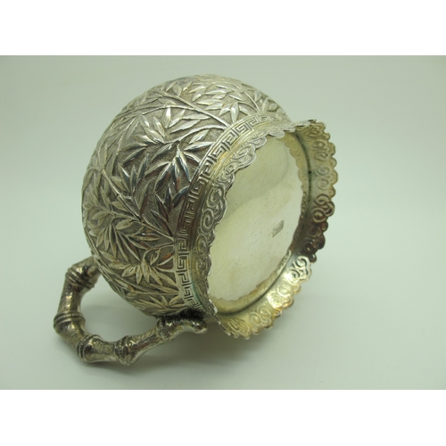 17 - A Chinese Three Piece Tea Set, each allover detailed in relief with bamboo (indistinctly stamped cha... 