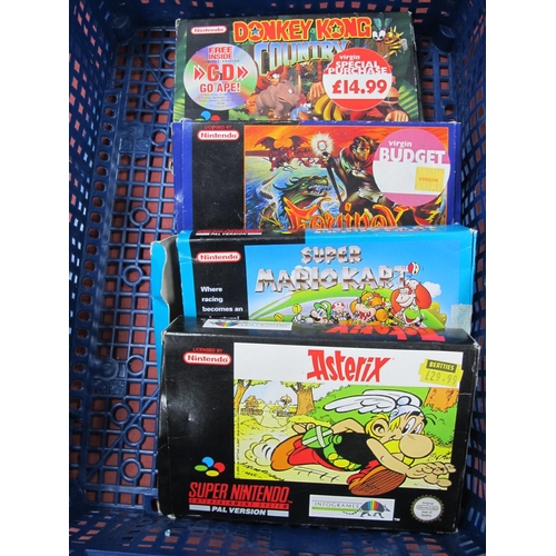 566 - Four Super Nintendo Entertainment System (SNES) Games Cartridges to include Donkey Kong Country, Ast... 