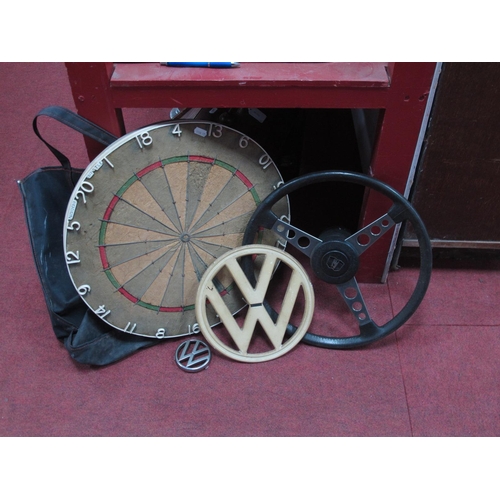 1151 - VW Badges, one large and one small, steering wheel, and a dartboard.