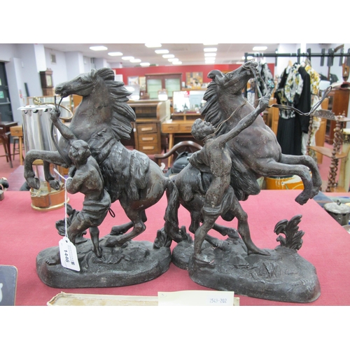 1446 - Pair of Early XX Century Spelter Marley Horse and Tetherer figure groups, 27cm high. (2).