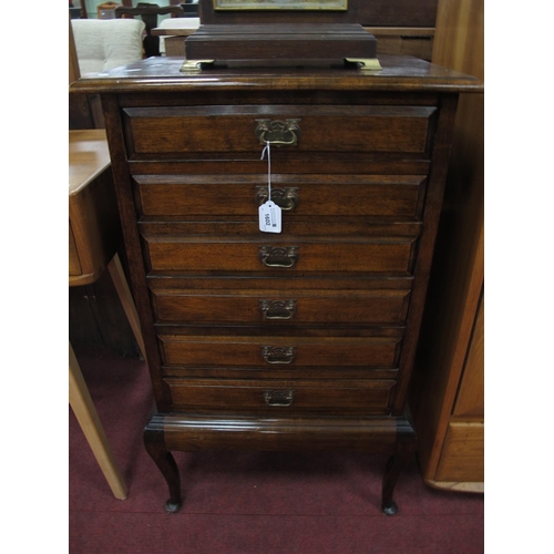 1602 - Early XX Century Stained Mahogany Music Cabinet, top with a molded edge, six drawers on cabriole let... 