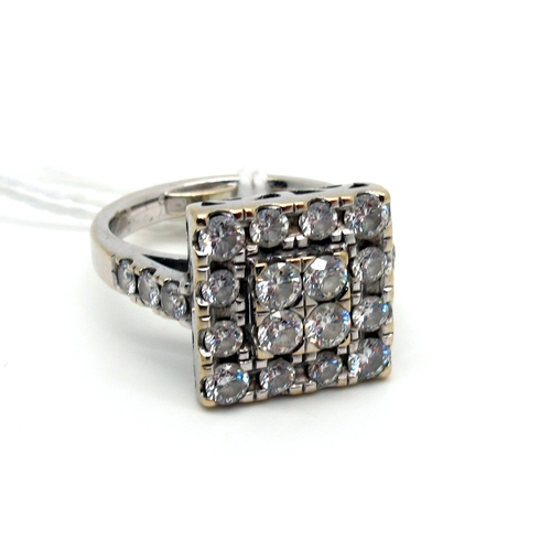 220 - A Large Diamond Set Square Panel Ring, set throughout with graduated brilliant cut stones , between ... 