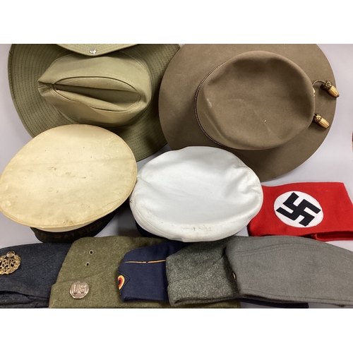 726 - Military headgear of various types/branches of service and nationalities including USMC Stetson hat,... 