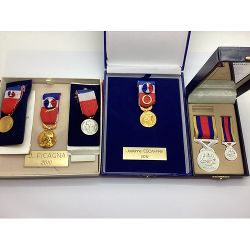 738 - Four Boxed French Labour Medals, together with a Malaysian Peacekeeping medal with a matching miniat... 