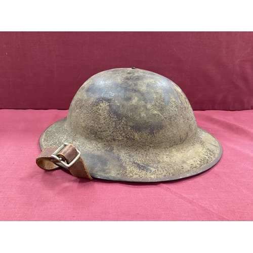 743 - WW1 British Army Brodie Mk I steel helmet with part liner and leather chin strap marks on the interi... 