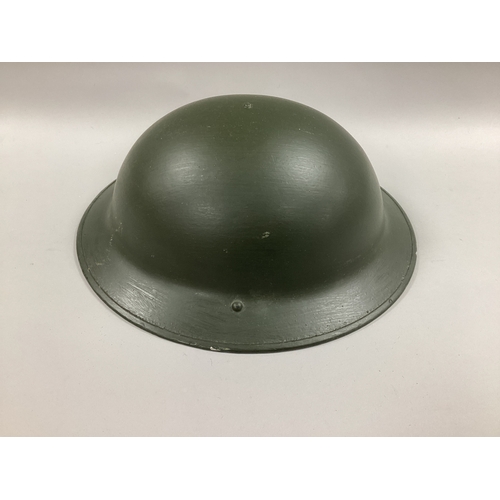 747 - British Army Brodie Combat Helmet, with liner and chin strap.