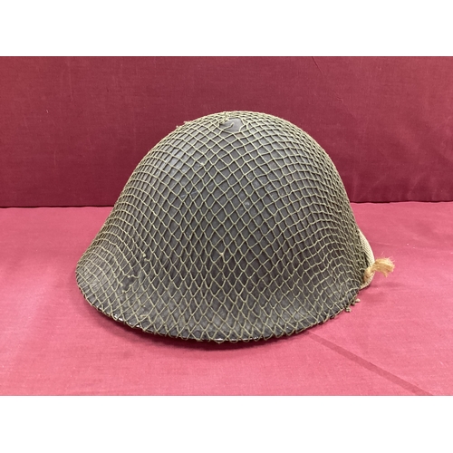 757 - WW2 Army steel 'turtle' Mk 3 combat helmet with liner (stamped 1945), chin strap and net cover.