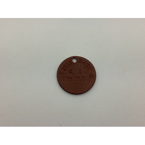 809 - WWI single red circular fibre identification tag marked '72712 TATE C E KOYLI'.