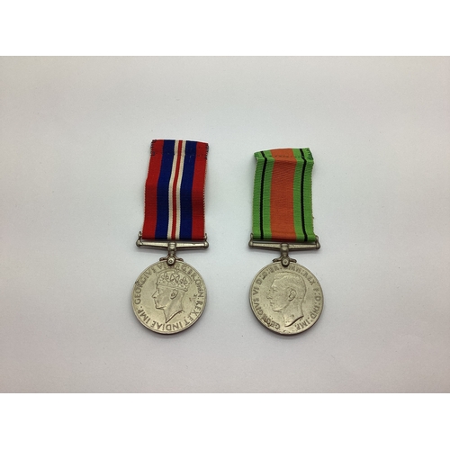 855 - WWII British Medals Comprising Defence Medal And 1939-45 War Medal.