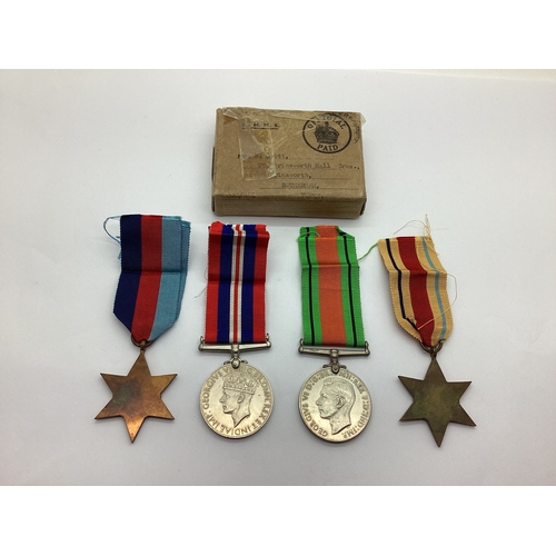 861 - WWII British Medals With Original Box And Ribbons, comprising 1939-45 Star, Africa Star, Defence Med... 