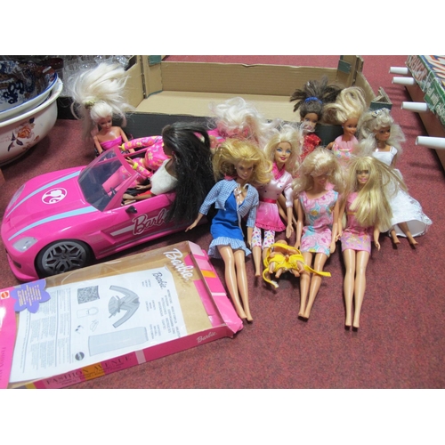 1013 - A collection of Barbie dolls together with a Barbie Dream car.