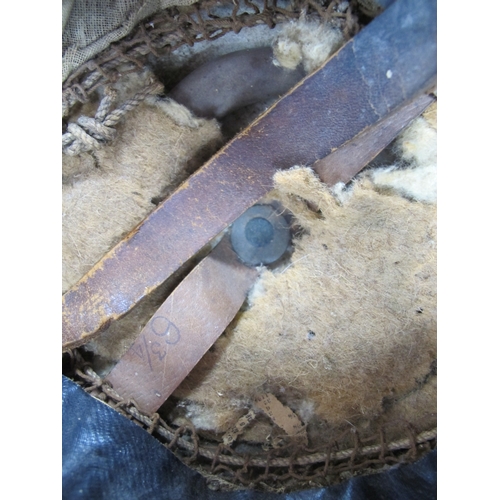 743 - WW1 British Army Brodie Mk I steel helmet with part liner and leather chin strap marks on the interi... 