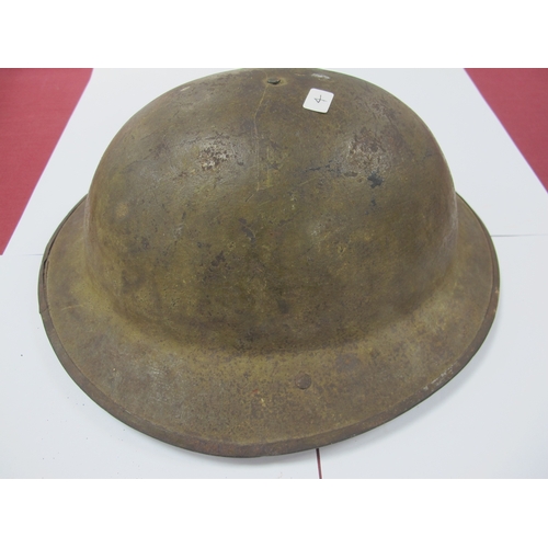 764 - WWI British Army Brodie Mk I steel helmet with part liner and leather strap, marks on the interior o... 