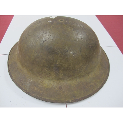 764 - WWI British Army Brodie Mk I steel helmet with part liner and leather strap, marks on the interior o... 