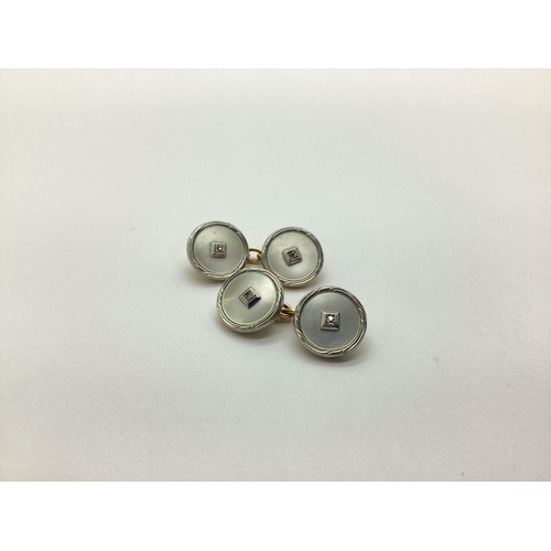 140 - A Pair of Art Deco Style Mother of Pearl Cufflinks, the circular panels on chain connections, stampe... 