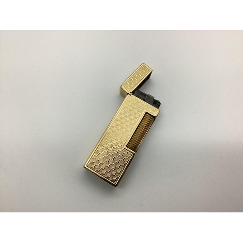 142 - Dunhill; A 9ct Gold Cigarette Lighter, allover engine turned decoration, London 1966, 6.5cm.