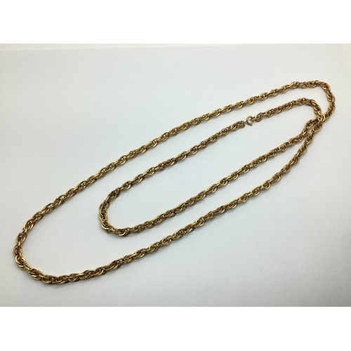 165 - Trifari; A Vintage Gilt Metal Long Chain, suspending small gilt metal hand tag.