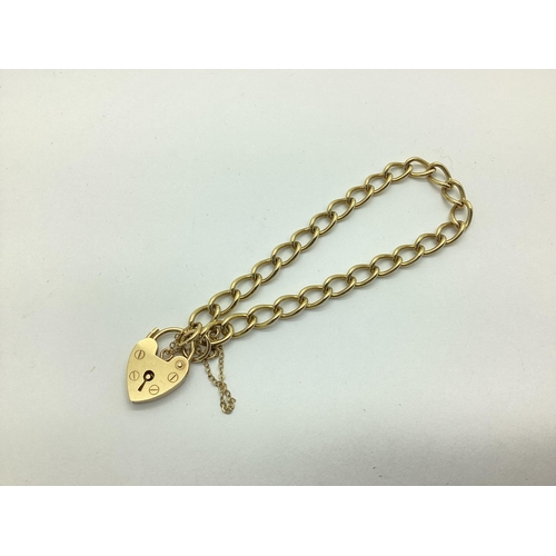 212 - A 9ct Gold Curb Link Bracelet, to 9ct gold heart shape padlock style clasp.