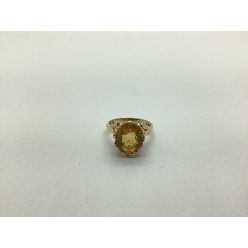 219 - A 9ct Gold Single Stone Dress Ring, oval claw set, between shaped shoulders (finger size N) (overall... 