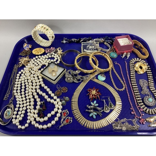 63 - Imitation Pearls, Indian gilt metal bangles, costume brooches, earrings, etc :- One Tray