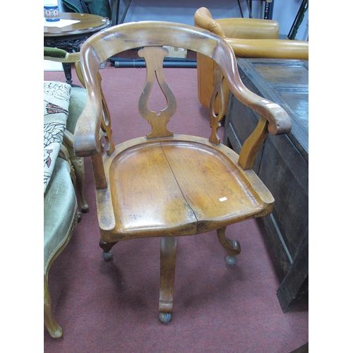 1503 - XIX Century mahogany office chair with swivel action, pierced splat supports to hoop back on four ca... 