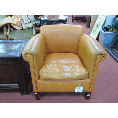 1507 - A Tan Leather Armchair, on square supports