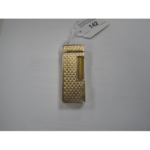 142 - Dunhill; A 9ct Gold Cigarette Lighter, allover engine turned decoration, London 1966, 6.5cm.